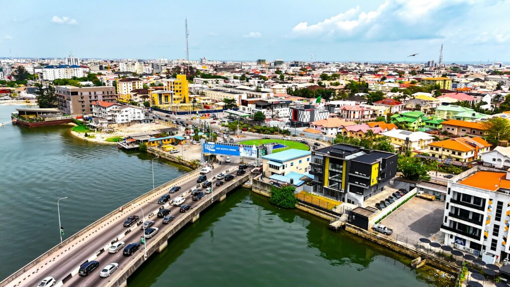 Aerial view of waterfront streets and a bridge in Lagos, Nigeria.